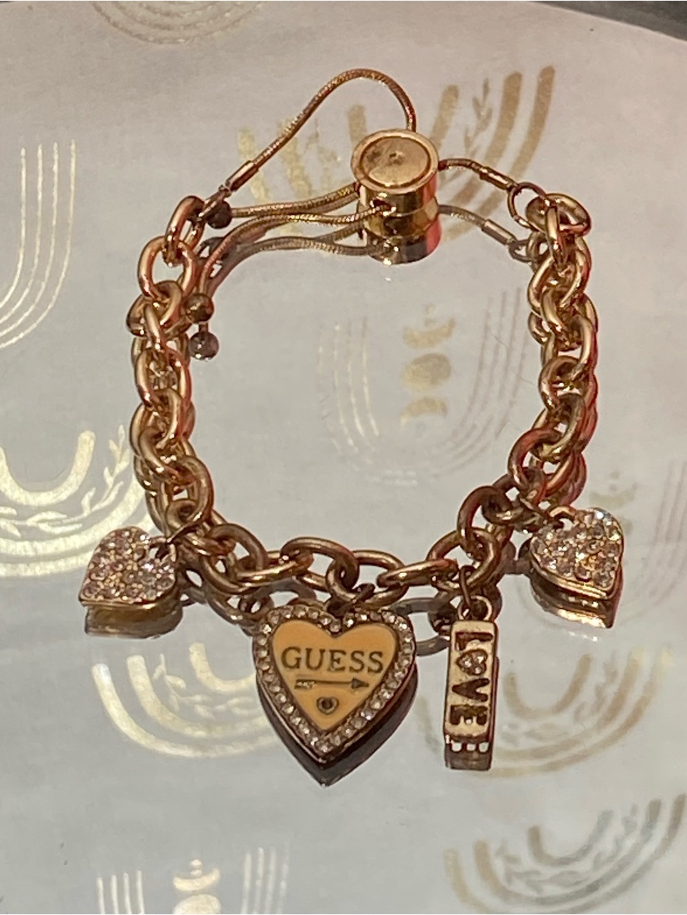 GUESS Rose Gold Heart Charm Bracelet with Crystal Accents